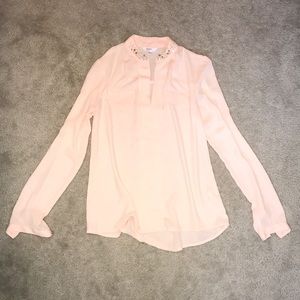 Candie’s pink blouse with jewels at neckline